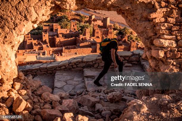 Tourist walks near the Kasbah of Ait-Ben-Haddou , where scenes depicting the fictional city of Yunkai from the hit HBO television series "Game of...