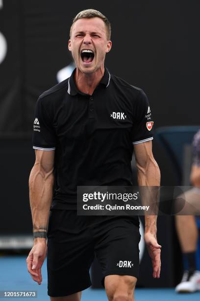 Marton Fucsovics of Hungary celebrates after winning match point during his Men's Singles third round match against Tommy Paul of the United States...