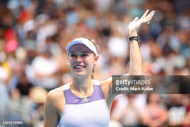 Caroline Wozniacki of Denmark acknowledges the crowd after losing her Women's Singles third round match against Ons Jabeur of Tunisia on day five of...