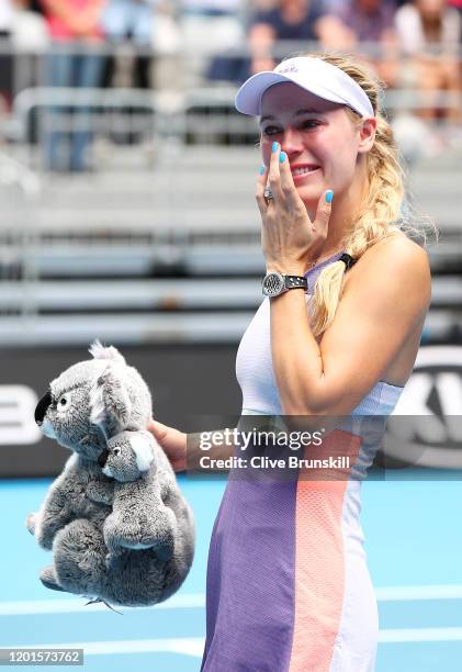 Caroline Wozniacki of Denmark sheds a tear after losing her Women's Singles third round match against Ons Jabeur of Tunisia on day five of the 2020...