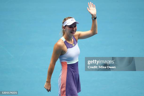 Caroline Wozniacki of Denmark acknowledges the crowd after losing her Women's Singles third round match against Ons Jabeur of Tunisia on day five of...