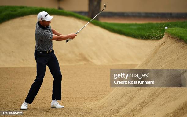 Benjamin Hebert of France plays his third shot on the tenth hole from a bunker during Day Two of the Omega Dubai Desert Classic at Emirates Golf Club...