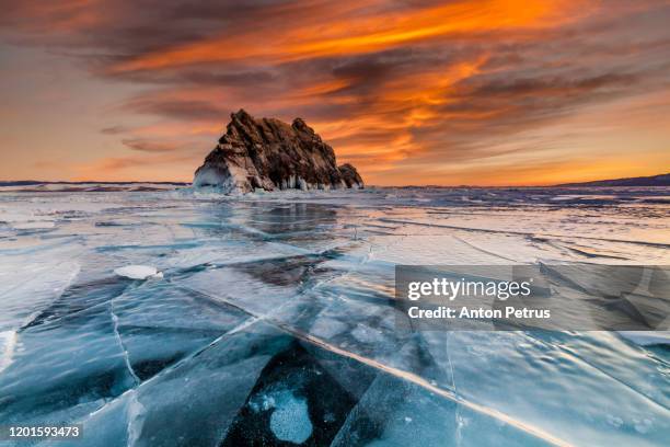 sunset on lake baikal in winter near elenka island - lake baikal stock pictures, royalty-free photos & images