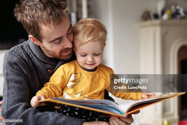 i'm gonna read this whole book today - single father stock pictures, royalty-free photos & images