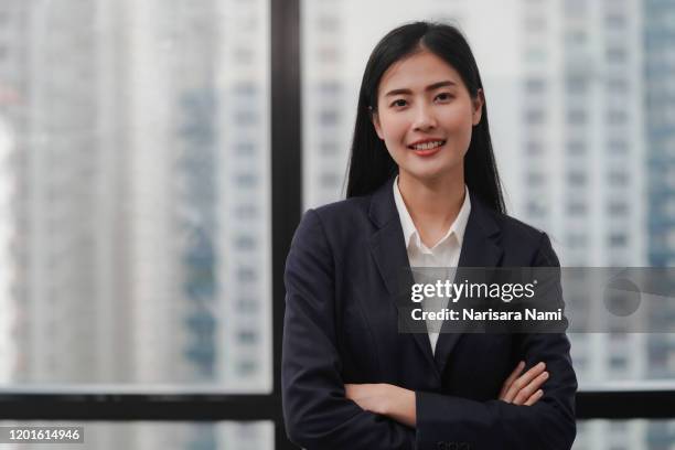 asian businesswoman in the office with copy space. - junior stock pictures, royalty-free photos & images