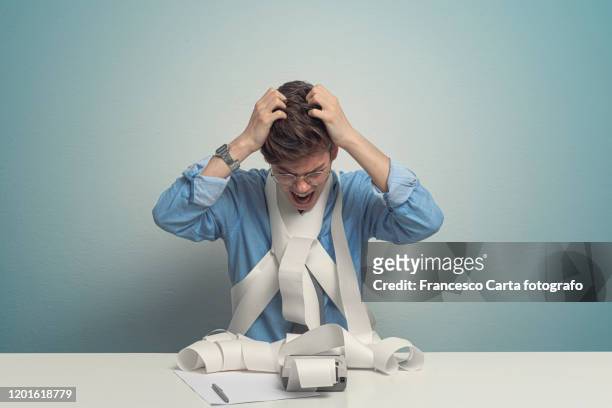 worried accountant using calculator - hopelessness stock pictures, royalty-free photos & images