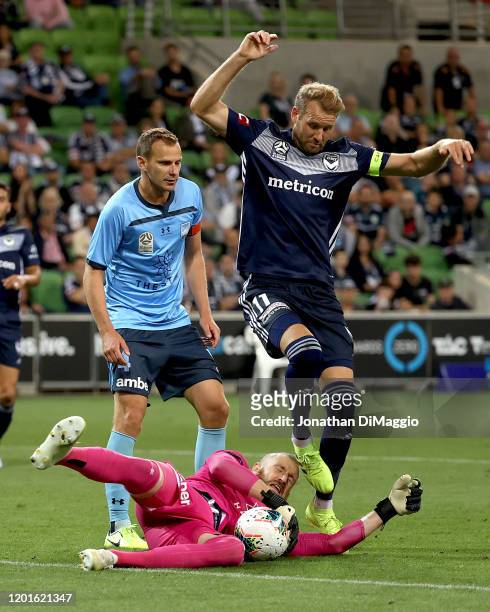 Ola Toivonen of Melbourne and Andrew Redmayne of Sydney collide during the round 16 A-League match between the Melbourne Victory and Sydney FC at...