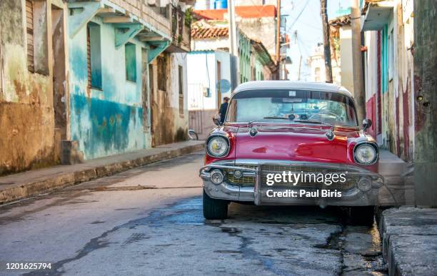 beautiful american red classic car on the street in santa clara,  cuba - audi summer tour stock pictures, royalty-free photos & images