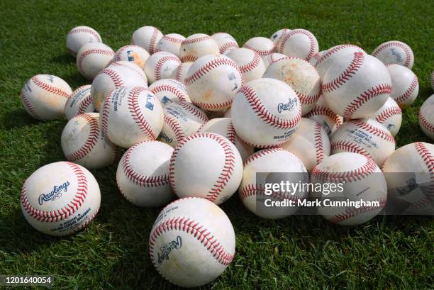 Detailed view of a group of Rawlings official Major League baseballs sitting on the field during the Detroit Tigers Spring Training workouts at the...