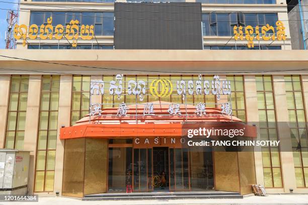 Man sits inside a casino in Sihanoukville on February 18, 2020.