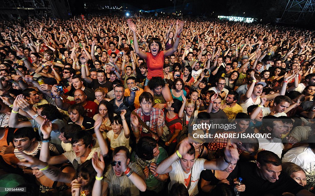 Festival goers cheer during a concert at