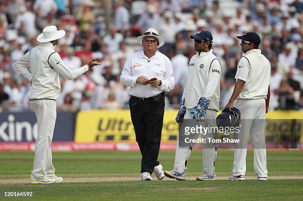 Umpire Marais Erasmus talks to the Indian players after Ian Bell of England is controversially run out during the second npower Test match between...