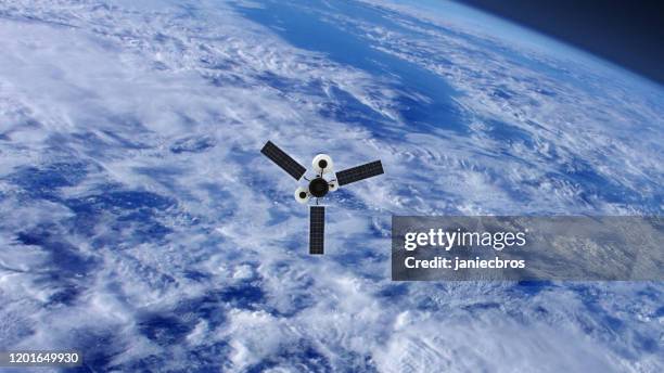 spy satellite orbiting earth. nasa public domain imagery - satellite surveillance stock pictures, royalty-free photos & images