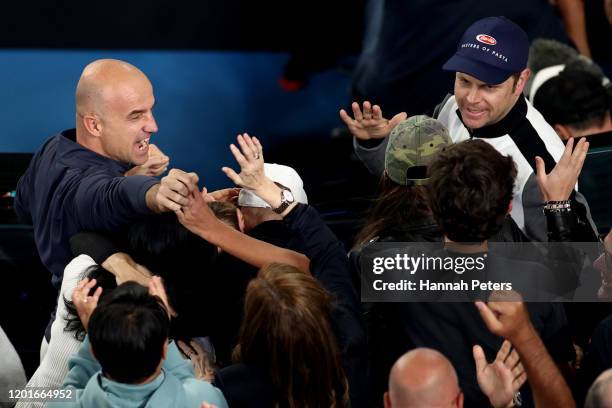 Roger Federer's coach Ivan Ljubicic celebrates after the Men's Singles third round match against John Millman of Australia on day five of the 2020...