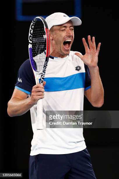 John Millman of Australia reacts during his Men's Singles third round match against Roger Federer of Switzerland on day five of the 2020 Australian...