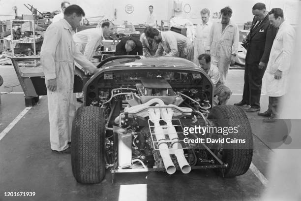 Mechanics assembling the Ford GT40 which the motor manufacturer will use to compete in the 24 Hours of Le Mans race, at the company's facility in...