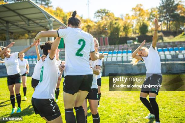 female soccer team doing the dab dance and celebrating the victory after soccer match - dab dance stock pictures, royalty-free photos & images