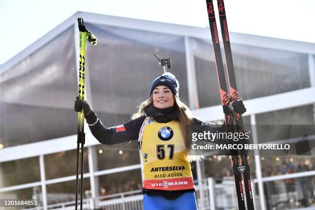 Italy's Dorothea Wierer celebrates on the podium after winning the IBU Biathlon World Cup Women's 15 km Individual Competition in Rasen-Antholz ,...
