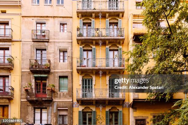 residential buildings facade in barcelona, catalonia, spain - barcelona spain fotografías e imágenes de stock