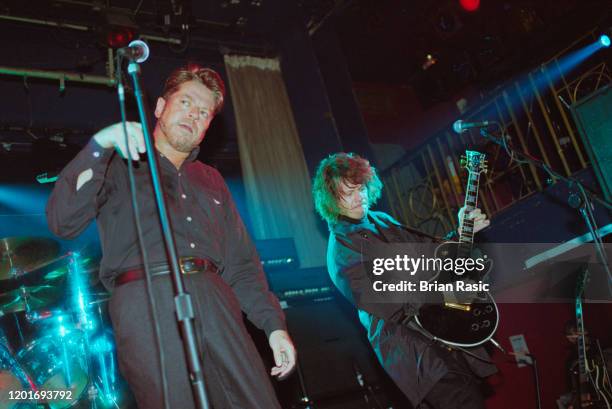 Singer Robert Palmer and guitarist Andy Taylor of the rock group The Power Station perform live on stage at the Hanover Grand venue in London on 17th...