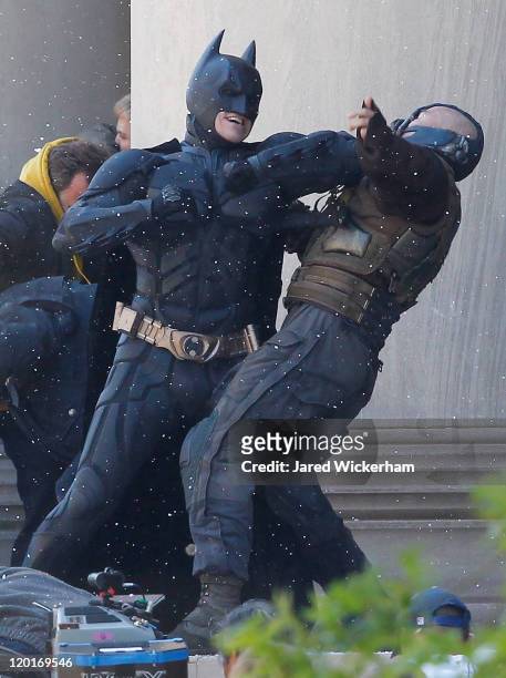 Christian Bale, playing Batman, acts in a scene with Tom Hardy, playing Bane, during the filming of the new Batman: Dark Knight Rises movie at the...
