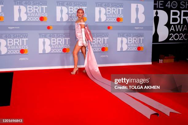 British singer-songerwriter Anne-Marie Nicholson poses on the red carpet on arrival for the BRIT Awards 2020 in London on February 18, 2020. /...