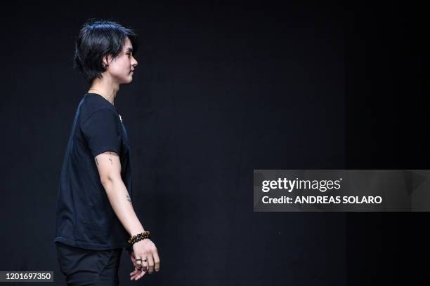 New York based Chinese designer Han Wen acknowledges applause following the presentation of his Fall - Winter 2020 collection, as part of the "China,...