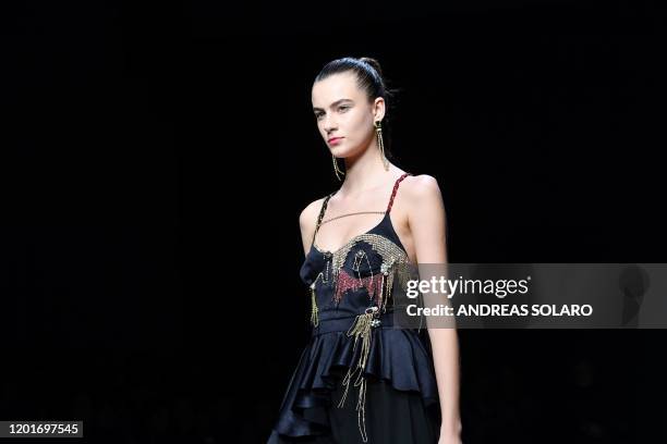 Model presents a creation for Chinese designer Han Wen's Fall - Winter 2020 collection, as part of the "China, We are With You" fashion event,...