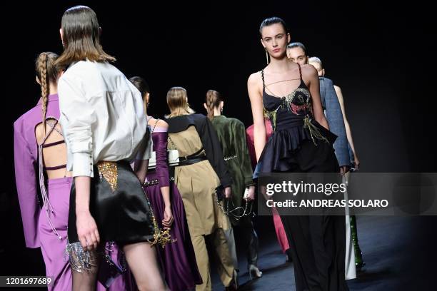 Models present creations for Chinese designer Han Wen's Fall - Winter 2020 collection, as part of the "China, We are With You" fashion event, kicking...