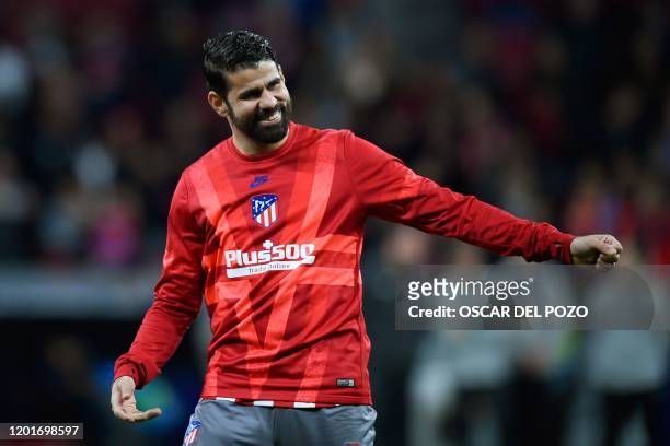 Atletico Madrid's Spanish forward Diego Costa warms up before the UEFA Champions League, round of 16, first leg football match between Club Atletico...