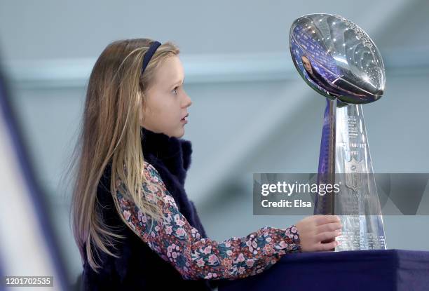 Lucy Manning admires the Vince Lombardi trophy after her father Eli Manning of the New York Giants, announced his retirement during a press...