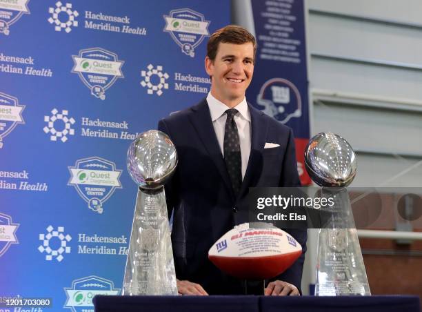 Eli Manning of the New York Giants poses with the Vince Lombardi Trophies after a press conference to announce his retirement on January 24, 2020 at...