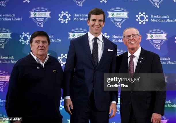 Ernie Accorsi, Eli Manning and Tom Coughlin pose for a picture after Manning announced his retirement during a press conference on January 24, 2020...