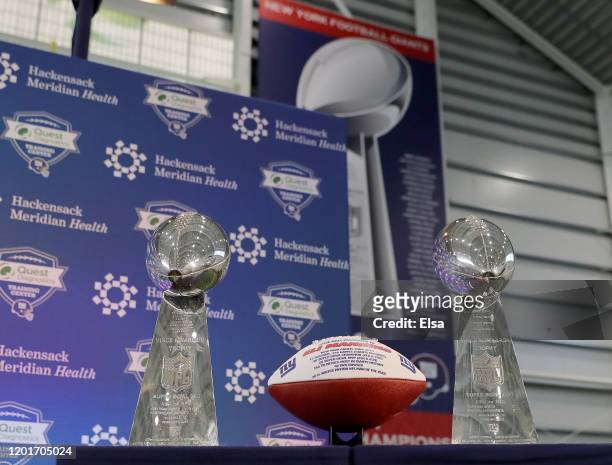 Football listing all the accomplishments of Eli Manning of the New York Giants is on display with the Vince Lombardi trophies before Eli Manning...