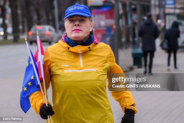 Eddie Izzard, English stand-up comic, actor, writer, and political activist runs the marathon distance 18th in a row with the slogan...