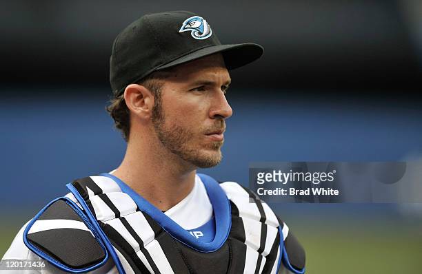Arencibia of the Toronto Blue Jays looks on prior to the game against the Baltimore Orioles July 28, 2011 at Rogers Centre in Toronto, Ontario,...