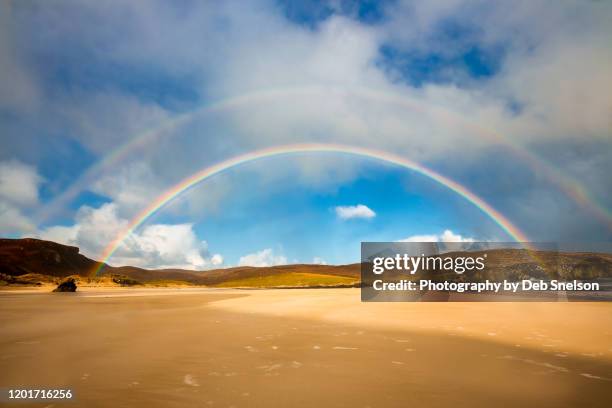 rainbows over garry beach isle of lewis scotland - dubbel regnbåge bildbanksfoton och bilder