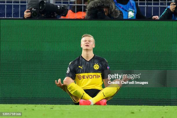 Erling Haaland of Borussia Dortmund celebrates after scoring his team's first goal during the UEFA Champions League round of 16 first leg match...