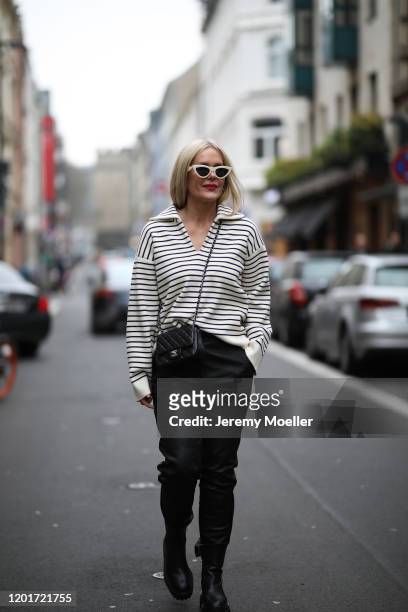 Judith Mosqueira do Amaral wearing Celine sweater and shades, Chanel handbag, ARMA leather pants, Zara Boots on January 24, 2020 in Cologne, Germany.