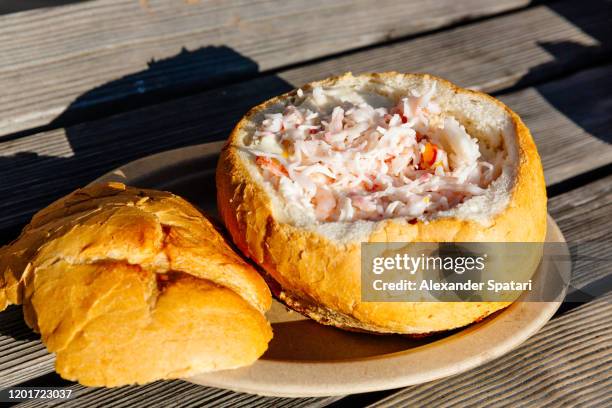 clam chowder served in a bread bowl - clam chowder stock pictures, royalty-free photos & images