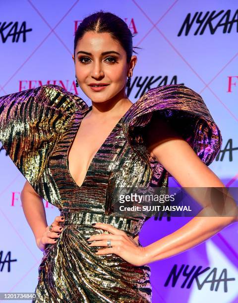 In this picture taken on February 18 Bollywood actress Anushka Sharma poses for photographs as she arrives at the 'Nykaa Femina Beauty Awards 2020'...