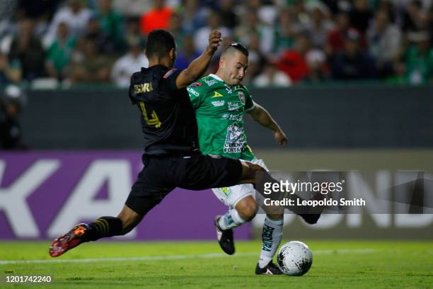 Jean Meneses of Leon vies for the ball with Eddie Segura of LAFC during the round of 16 match between Leon and LAFC as part of the CONCACAF Champions...