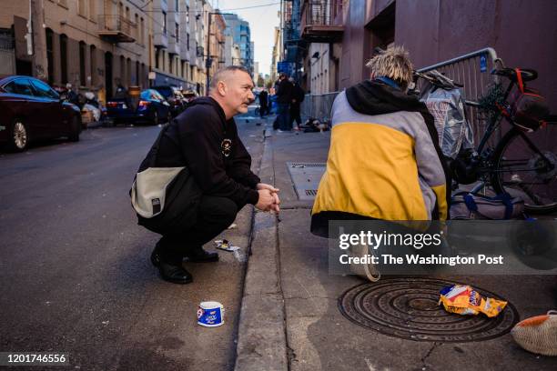 Paul Harkin, director of harm reduction at GLIDE speaks with people on a popular alley way with drug users in the Tenderloin neighborhood to handout...