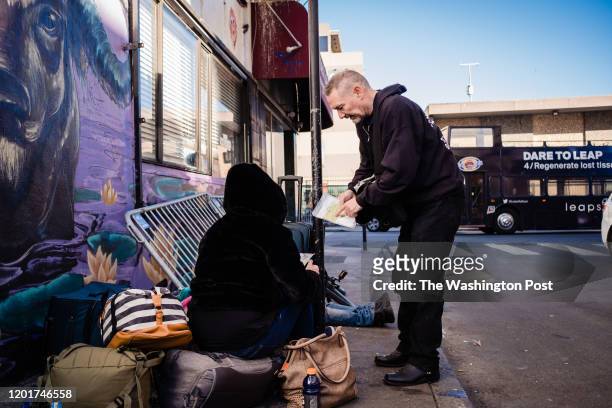 Paul Harkin, director of harm reduction at GLIDE speaks with people on a popular alley way with drug users in the Tenderloin neighborhood to handout...
