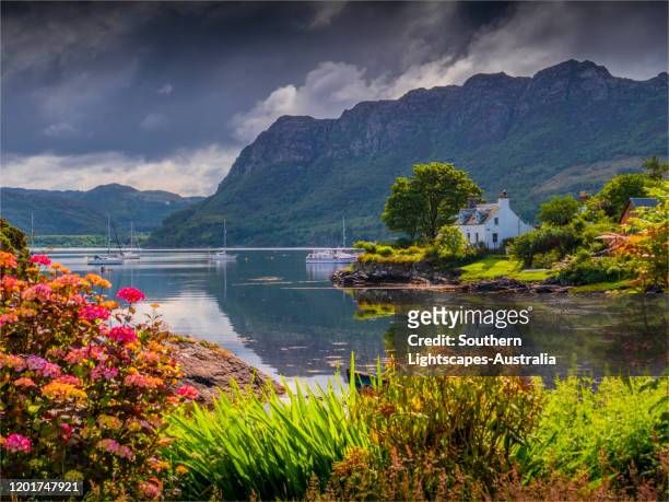 a view in the beautiful village of plockton on the shores of loch carron, western highlands, scotland, united kingdom - scottish coastline stock pictures, royalty-free photos & images