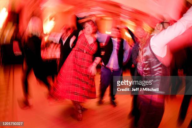 People ceilidh dance during the Burns & Beyond traditional Burns Supper in the Freemasons Hall on January 24, 2020 in Edinburgh, Scotland. The annual...