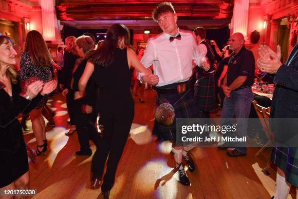 People ceilidh dance during the Burns & Beyond traditional Burns Supper in the Freemasons Hall on January 24, 2020 in Edinburgh, Scotland. The annual...