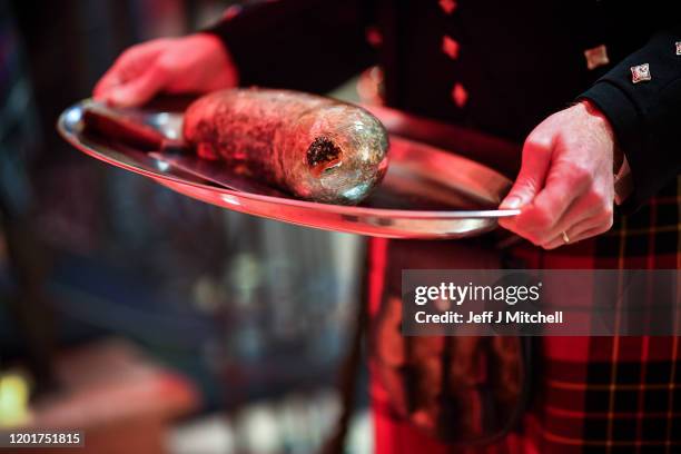 James Brodie holds the haggis during the Burns & Beyond traditional Burns Supper in the Freemasons Hall on January 24, 2020 in Edinburgh, Scotland....