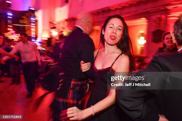 People ceilidh dance during the Burns & Beyond traditional Burns Supper in the Freemasons Hall on January 24, 2020 in Edinburgh, Scotland. The annual...