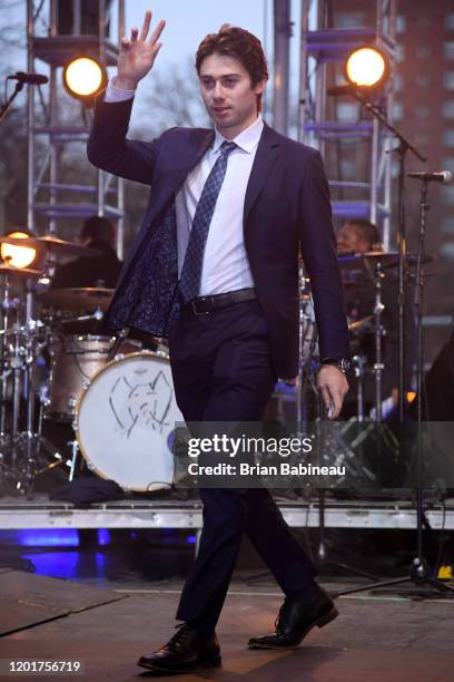 Quinn Hughes of the Vancouver Canucks is introduced onstage prior to the O.A.R. Performance at Enterprise Center as part of the 2020 NHL All-Star...